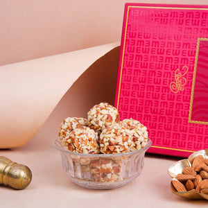 Badam Crunchy Ball from Mithdi, the best sweets in Surat, loaded with roasted almonds for a traditional Indian sweets experience.
