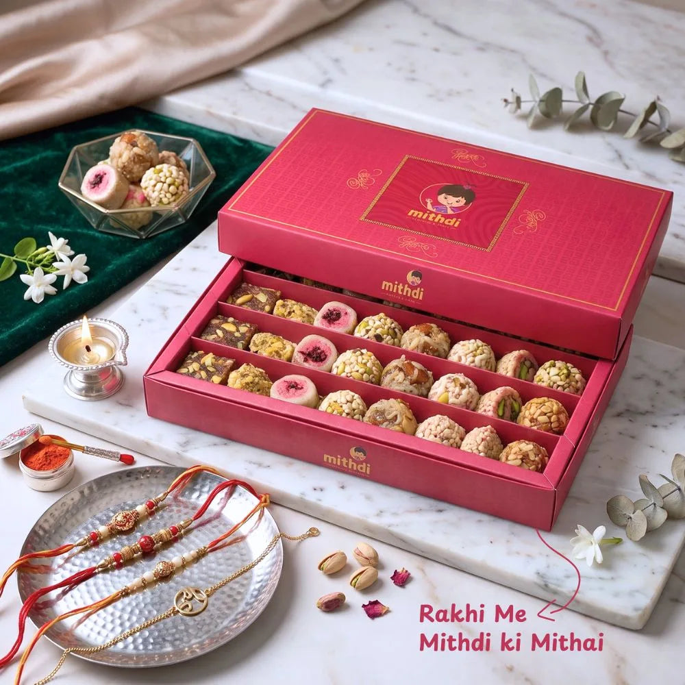 Mithdi assorted sweet box for Rakhi celebration featuring traditional rakhis and festive items