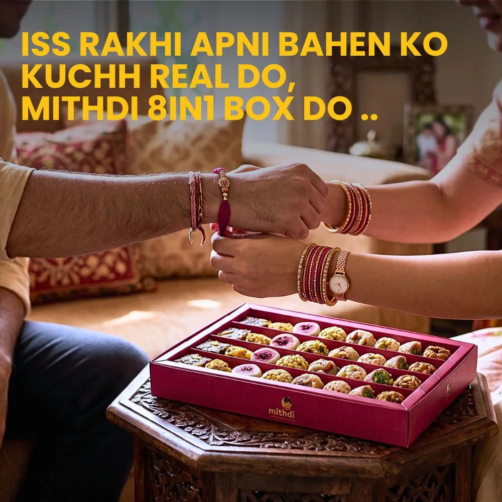 Brother and sister celebrating Raksha Bandhan festival with Mithdi assorted sweet box gift