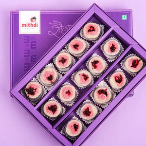 Beautifully arranged pink-centered sweets in a purple gift box, perfect for buy sweets gift online and special occasions in Surat.