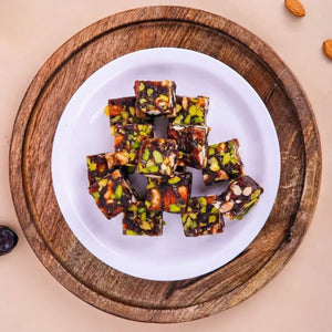 Buy Khajur Chikki online or get Khajur chikki delivery in Surat, India. Featuring the best Khajur dry fruit chikki online from Surat.